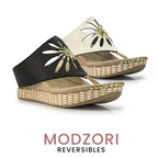Two Flora #1 wedge sandals by MODZORI, reversible from black to bone, featuring convertible straps, a laser-cut floral pattern, and woven sole details.