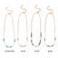 Four ganz Puka necklaces are showcased vertically, each 15" long with a 3" extender and featuring bead sections in turquoise, sand, multicolored, and grey. The word under each necklace perfectly matches its bead color.