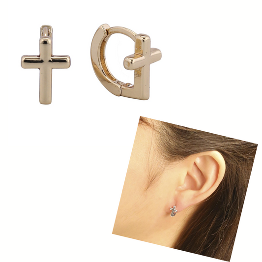 The FASHION GO Cross Ear Huggie Earring, crafted in 14K gold and hypoallergenic, is shown worn on an ear and individually. These stylish earrings provide comfort and elegance.