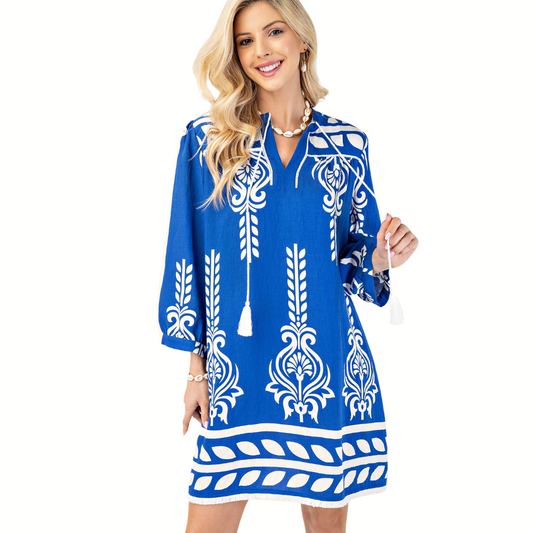 A woman wearing the FASHION GO 3/4 Sleeve Printed Dress smiles while standing against a white background.