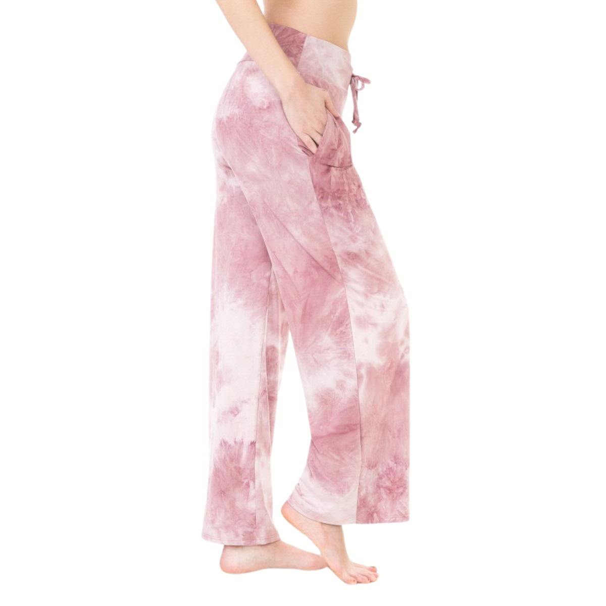 A person wearing FASHION GO’s Buttery Soft Pajama Pants with Drawstring in pink and white tie-dye, featuring wide legs and functional pockets, stands barefoot against a white background.