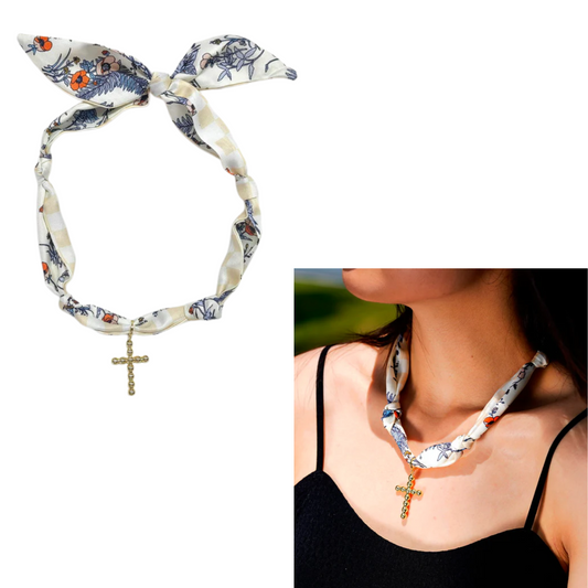 The Flipflops & Whatnots Scarf Necklace in Beige/Navy features a 1.25" bubble cross pendant, shown styled as fashion jewelry with a black top and displayed laid out for detail.