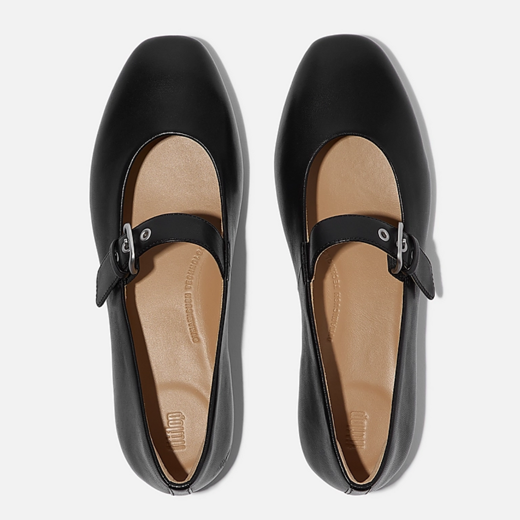 Delicato Leather Mary Janes in All Black by Fit Flops—a black nappa leather pair with square toes, single instep strap, and Dynamicush cushioning—shown from above on a white background.