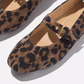 Close-up of Fit Flops' Delicato Leather Mary Janes in Leopard—comfortable nappa leather flats with a single strap and gold buckle, showcased on a neutral background.