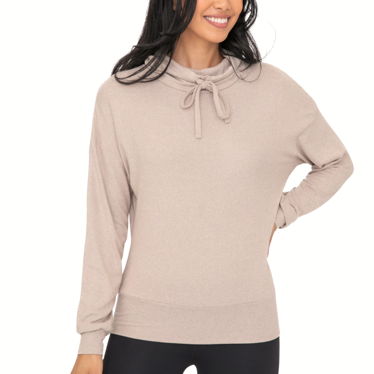 A woman poses with one hand on her hip, wearing the Mono B Brushed Cowl Neck Lounge Pullover and Wide Leg Lounge Pant Set in light beige and black.