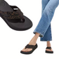 A person wears blue jeans and Fit Flops F-MODE Go Leopard Webbing Strappy Flip-Flops; a close-up shows the comfy footbed sandals' stylish, lightweight design.