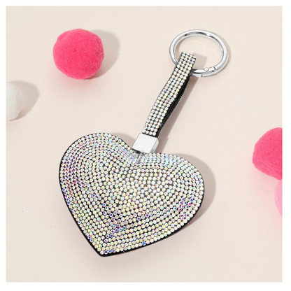 The Wona Trading Bling Heart Key Chain Bag Charm, covered in iridescent rhinestones and available in assorted colors, makes a perfect sparkly accessory for your bag.