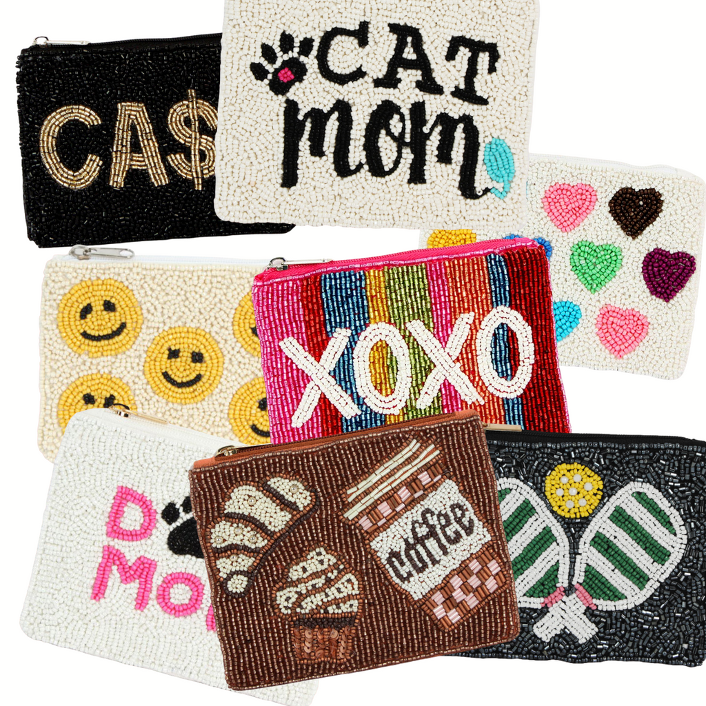 The Seed Bead Accented Mini Pouch Bag Assorted by Wona Trading features fun designs and sayings like "CAT MOM," "XOXO," "CA$H," emojis, hearts, pastries, and tennis rackets—an ideal gift for any fashion lover.
