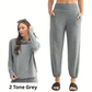 A woman wears the Mono B Brushed Hacci Cowl Neck Pullover and Jogger Set in 2 Tone Grey; features a cozy layering top with matching jogger pants. Close-up of pants shown beside her.
