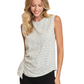 A woman models the Umgee Striped Sleeveless Shirred Top, featuring light gray stripes and side shirring, paired with black pants against a white background.