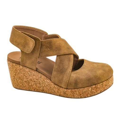 The Case Closed Wedge in Tan by CORKY'S FOOTWEAR INC features crisscross leather straps, a closed toe, open heel, cork platform sole, and cushioned footbed for all-day comfort. Shown on a white background.