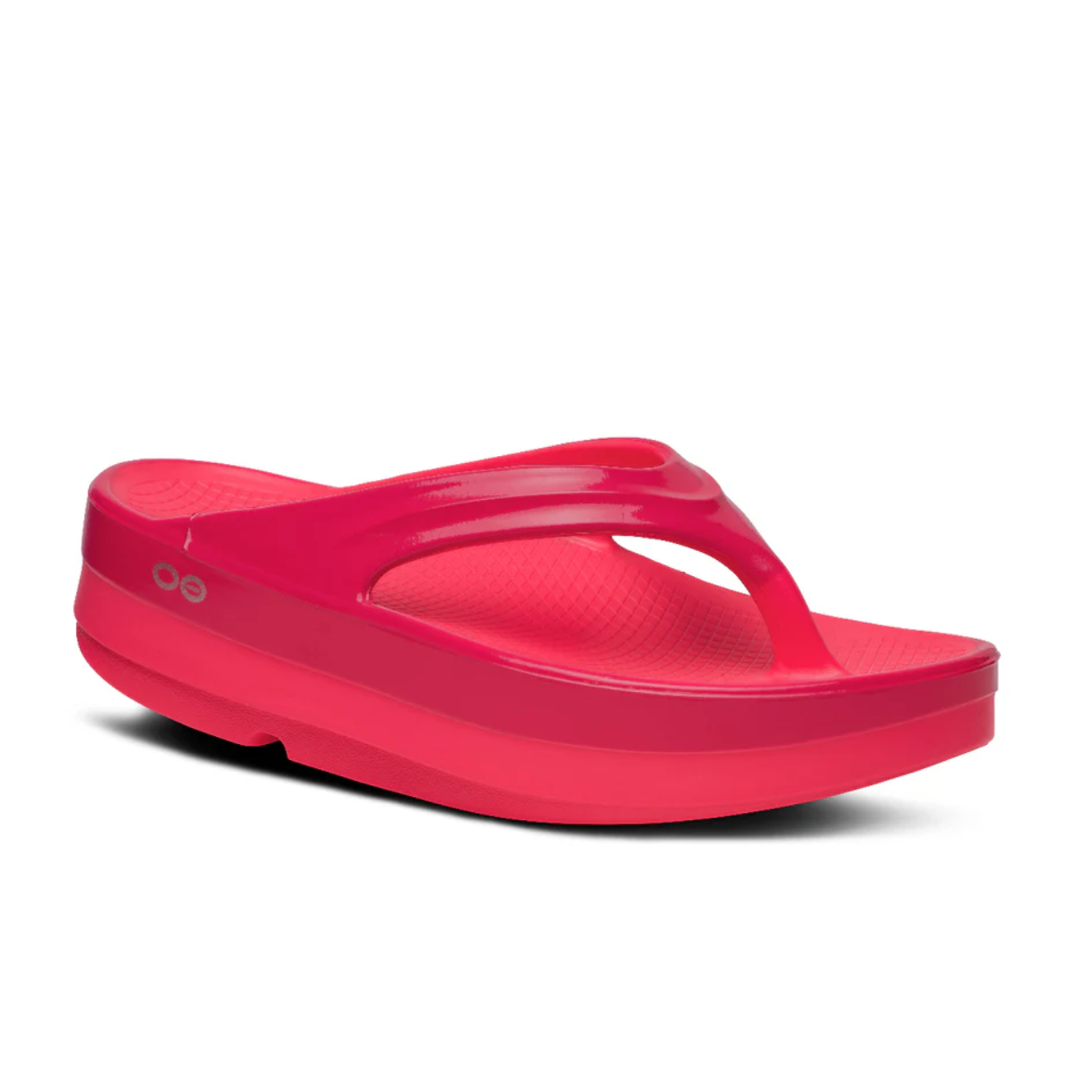 The Women's Oofos OOMEGA THONG Recovery Flip Flop in Neon Berry by OOFOS LLC features a thick OOfoam platform sole and textured footbed for active recovery, shown on a white background.