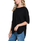 A woman stands in a relaxed pose against a white background, wearing the FASHION GO Basic Crew Neck T-Shirt in black with elbow-length sleeves and blue jeans.