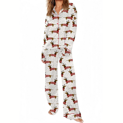Wearing Fashiongo’s Weeinie Dog Pajama Sets, which feature a dachshund print on a silky-soft button-up shirt and matching pants, a person stands against a plain background.