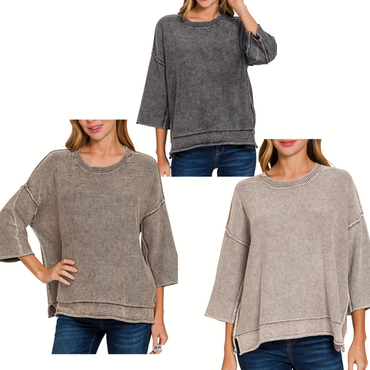 Three women wear FASHION GO Washed Cotton 3/4 Sleeve Boxy Fit Sweaters in dark gray, taupe, and light beige with blue jeans, posed against a white background.