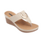 The Genelle Comfort Wedge Sandal by Good Choice features a beige leather top, open toe, wide strap with metallic circular accent, cushioned memory foam footbed, and a brown stitched sole.