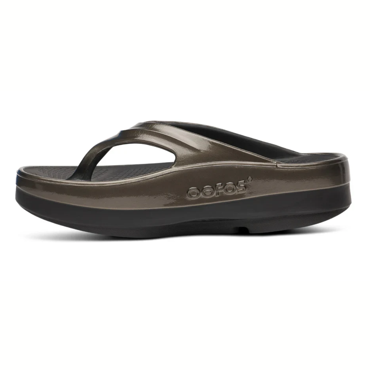 Side view of a single OOFOS LLC OOmega OOlala sandal in Titanium Mirror, showing its thick cushioned OOfoam™ sole for enhanced comfort and arch support, set against a white background.