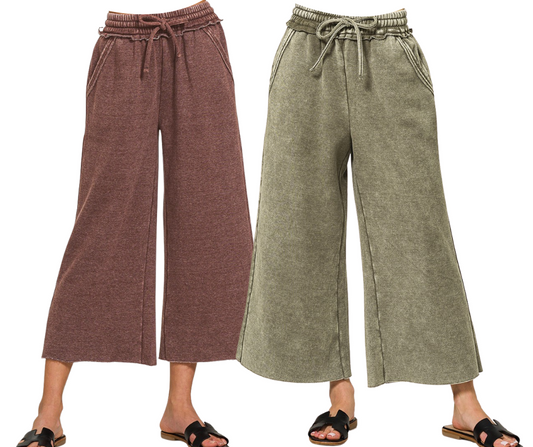 Two women wear Zenana Acid Washed Fleece Palazzo Sweatpants, one in brown and one in olive green, styled casually with black sandals.
