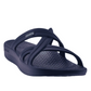 A Mallory in Deep Ocean by Telic with crisscross straps and a textured footbed designed for comfort, these lightweight shoes are doctor recommended.