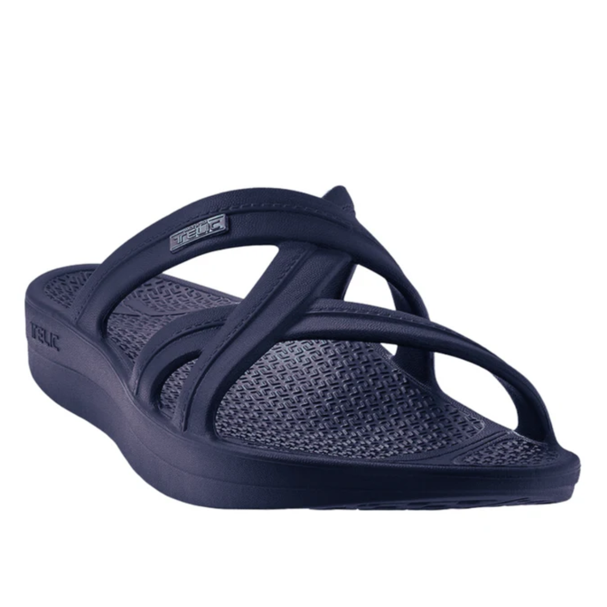 A Mallory in Deep Ocean by Telic with crisscross straps and a textured footbed designed for comfort, these lightweight shoes are doctor recommended. Main image