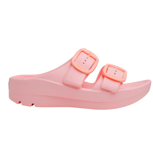 A pink slip-on sandal with two adjustable buckle straps, a slight platform heel, and an anatomically correct footbed for arch support is the Boise Bliss in Rose Quartz by Telic from TELIC.