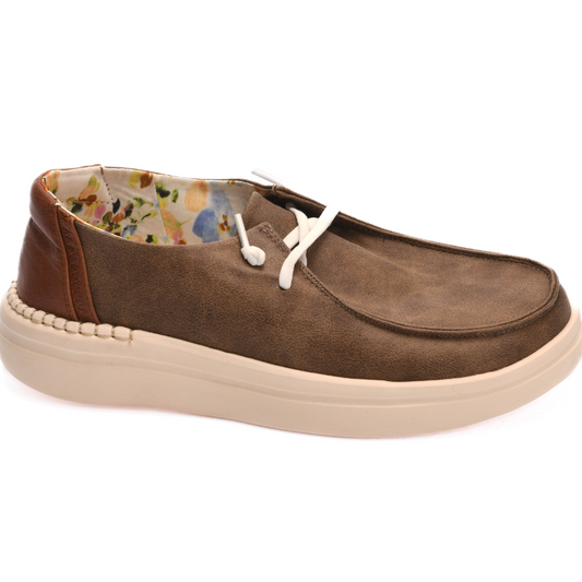 The Kayak 2 in Tan by Corkys is a brown casual shoe with a white sole, featuring floral-patterned interior lining and white laces, designed for comfort and style. With extra ankle padding, these sneakers ensure you stay comfortable all day.