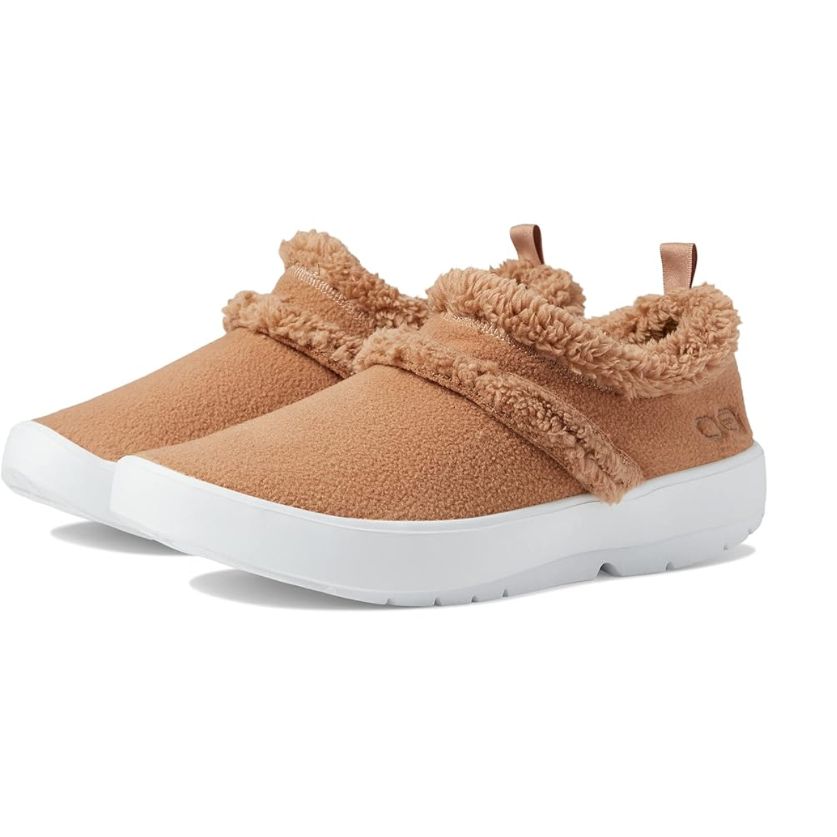 A pair of the Oocoozie in Chestnut by OOFOS, showcasing tan slip-on design with white soles and a cozy vegan sherpa material lining, enhanced with OOfoam™ technology for ultimate comfort, viewed from an angle.