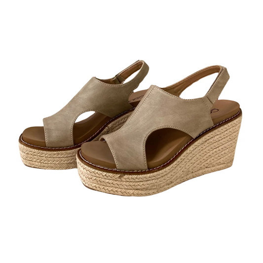 Freddie Wedge in Taupe by Corky's with open toes and slingback straps, these stylish shoes from CORKY'S FOOTWEAR INC feature a comfortable wedge heel, braided rope platform sole, and cut-out details on the sides.