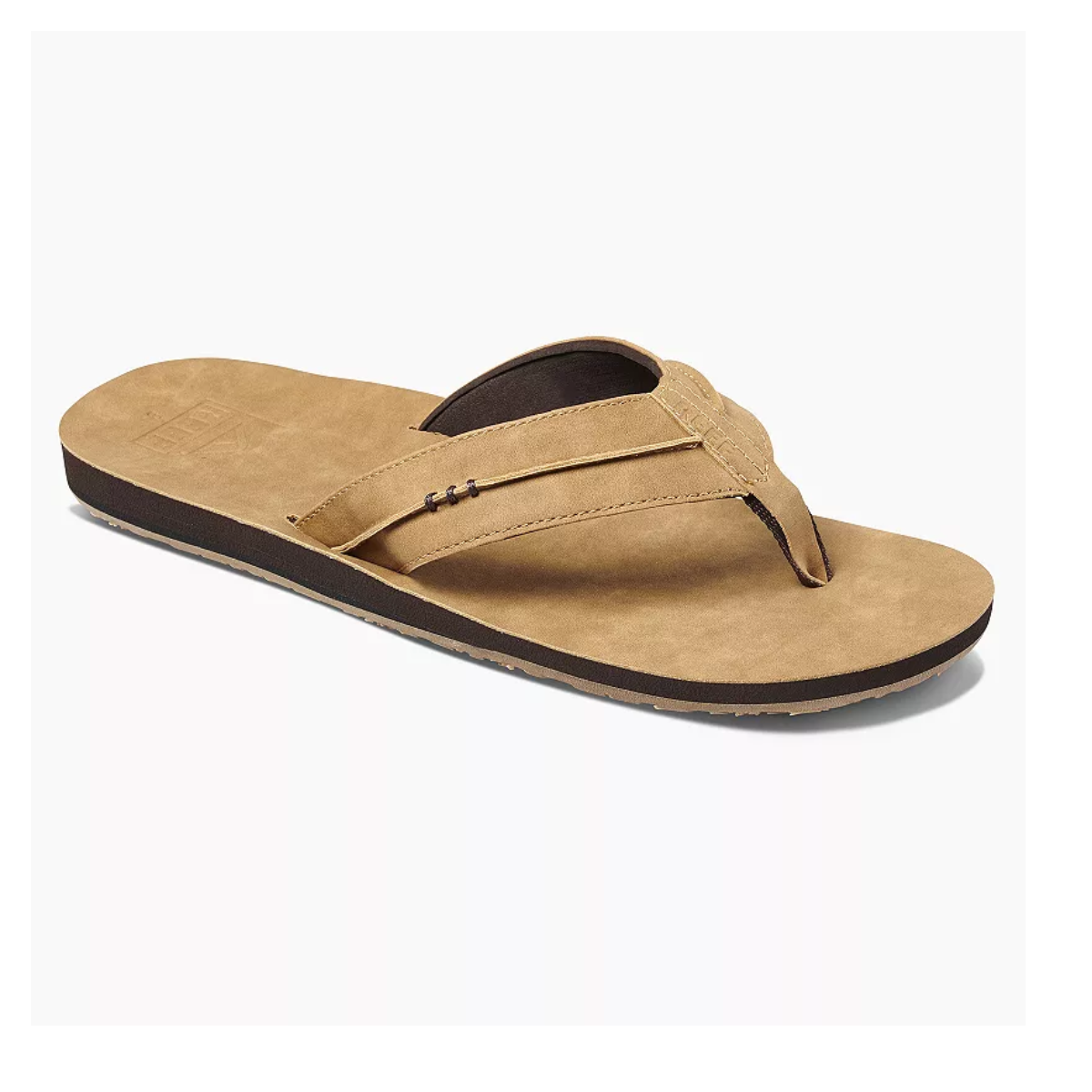 A single tan flip-flop sandal with a thick strap and dark brown footbed, viewed from a slightly angled position against a white background. The sandal boasts vegan leather uppers and compression-molded EVA midsoles, characteristic of Marbea Men's flip-flops in Brown by REEF.