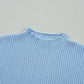 A Patch Pocket Ribbed Knit Short Sleeve Sweater by Shewin in light blue, featuring a round neck and visible pocket, ideal for transitional weather.