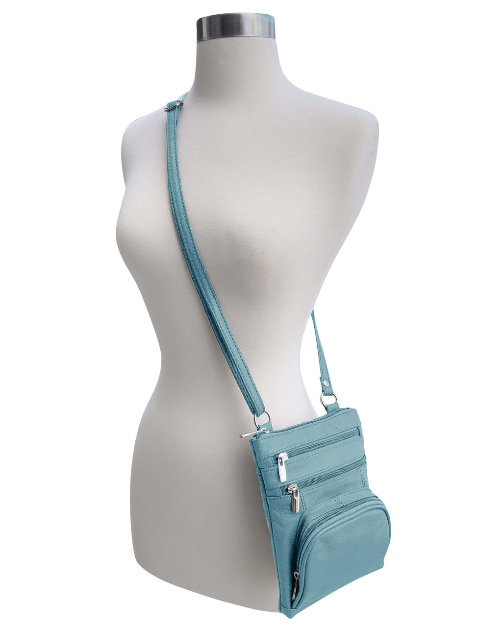 A mannequin displays the Roma Leathers, Inc. Cowhide leather Crossbody with phone pocket back side, featuring multiple zippered compartments and an adjustable shoulder strap, set against a white background.
