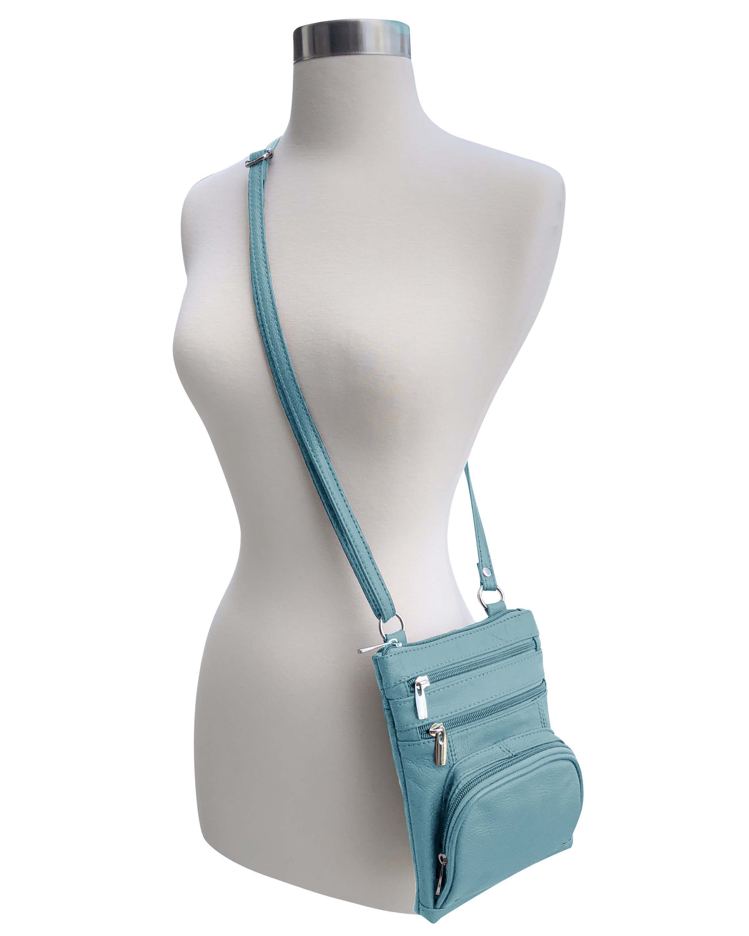 A mannequin displays the Roma Leathers, Inc. Cowhide leather Crossbody with phone pocket back side, featuring multiple zippered compartments and an adjustable shoulder strap, set against a white background.