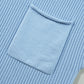 Close-up of Shewin's Patch Pocket Ribbed Knit Short Sleeve Sweater in light blue, featuring a square pocket that adds charm or creates a cozy ambiance.