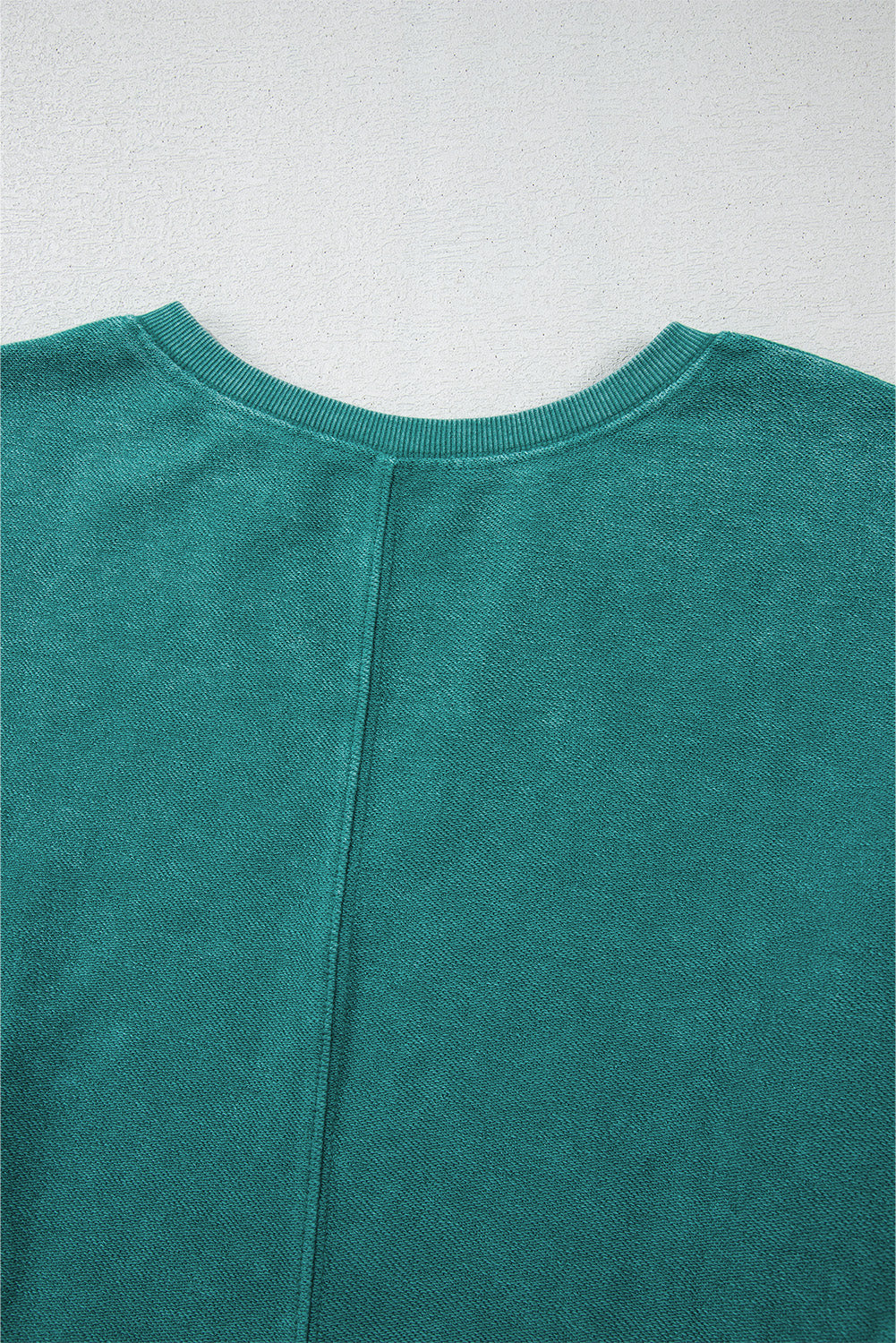 Back view of Shewin's Notched Neck Exposed Seam Drop Shoulder Sweatshirt in green, crafted from high-quality fabric.