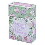 The Christian Art Gifts Box of Blessings Prayers and Promises for Women features a beautifully designed white and green box adorned with pastel flowers and greenery, filled with uplifting Scripture promises to inspire women every day.
