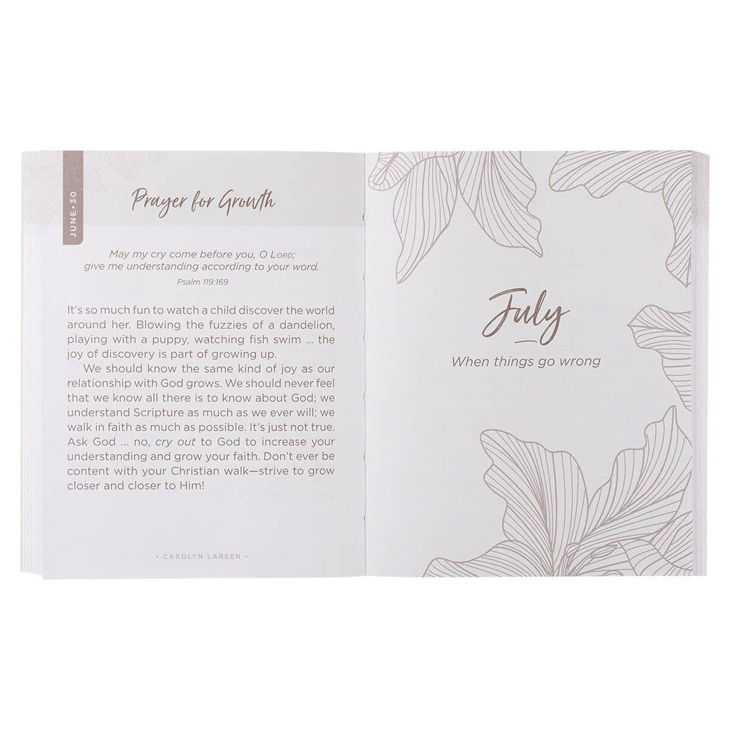 The One-Minute Devotions for Women Softcover by Christian Art Gifts is open to a page titled “July: When things go wrong,” featuring a prayer for growth, reflections on learning from children, and elegant flower line art. The pages provide uplifting one-minute devotionals designed especially for women.