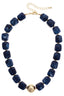 Palermo Resin Beaded Necklace in blue marbled resin with gold-toned spacers, a central gold sphere, and a lobster claw clasp.