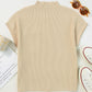 A flat-laid Patch Pocket Ribbed Knit Short Sleeve Sweater by Shewin in beige appears ideal for transitional weather, surrounded by sunglasses, an open book, and white sneakers with red accents.