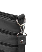Close-up of the Roma Leathers, Inc. Cowhide leather crossbody, featuring black cowhide leather, a metal zipper, strap with metal snap, zippered pockets, and a silver swivel clasp on a metal ring.