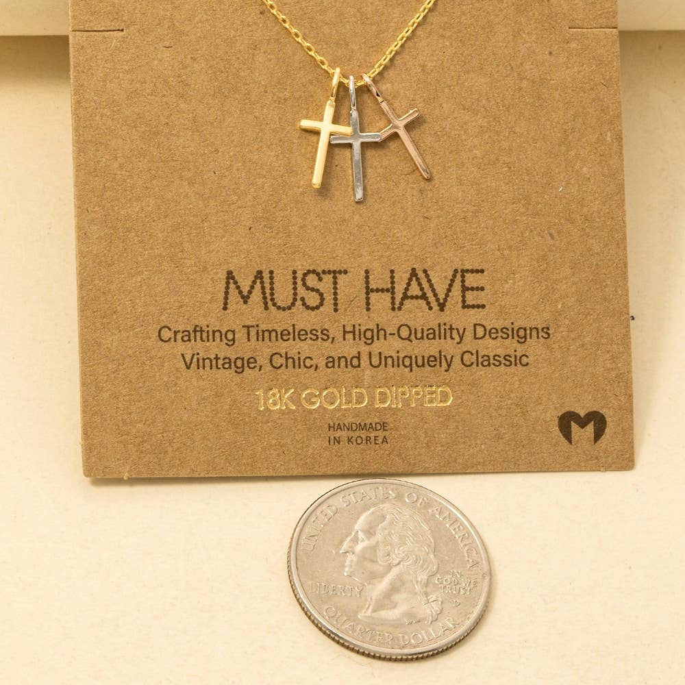 The Anarchy Street Triple Cross Pendant Necklace features a gold-dipped triple cross design on a chain, shown with a U.S. quarter for size reference.