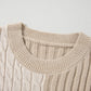 A close-up of the Shewin Khaki Cable Knit Colorblock Crew Neck Drop Shoulder Sweater highlights its mix of cable and ribbed patterns, enriched with detailed rib-knit elements.