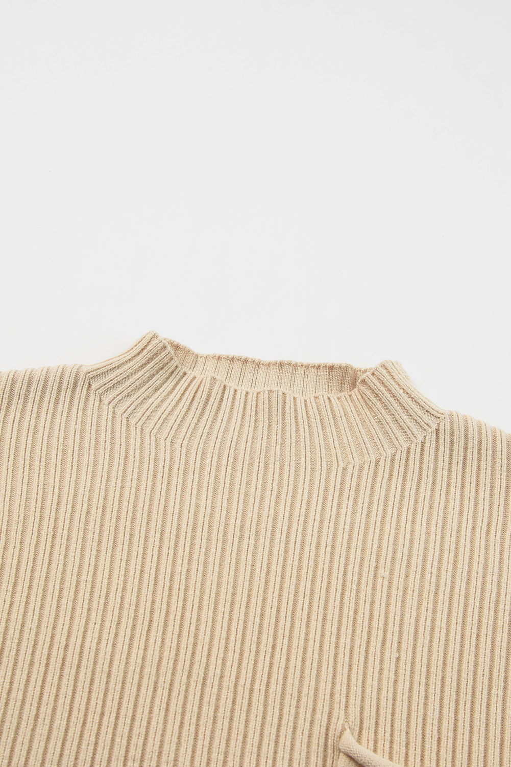 The Shewin Patch Pocket Ribbed Knit Short Sleeve Sweater in beige, ideal for transitional weather with its crew neckline, is displayed flat on a white background.