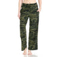 A person wears Leggings Depot Buttery Soft Print Pajama Pants in green camouflage with an elastic waistband, standing barefoot with hands in pockets against a white background.