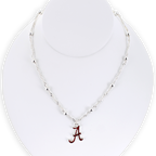 Show your school pride with the Alabama Glitter Enamel Logo Necklace by Seasons Jewelry. This silver beaded necklace features a crimson “A” logo pendant accented with sparkling glitter enamel, beautifully displayed on a white necklace stand—a shimmering tribute to University of Alabama spirit.