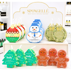 A store display of Spongelle Holiday Bath Soap Sponges shaped like holiday ornaments, snowmen, wreaths, Christmas trees, and gingerbread men.