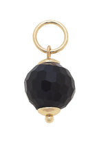 The Canvas Style Resin Bead Charm features a faceted black resin bead with gold-tone metal accents and a round loop at the top, making it perfect for adding sophisticated style to your favorite charm bracelet or necklace.