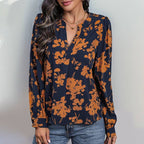 Navy and Orange Print Pull Over Blouse in navy blue with a notched neckline and an orange floral print, featuring long sleeves.
