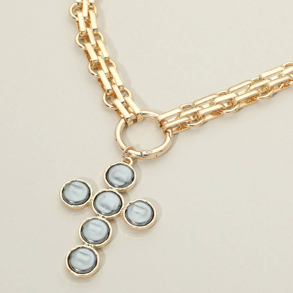 Discover the Pearl Cross Charm Pendant Chunky Chain Statement Necklace by Sensibling Corp.—an elegant gold chain necklace featuring a textured cross pendant, beautifully crafted with six round, grayish-white pearl-like stones set in gold, and finished with a circular clasp for a timeless touch.