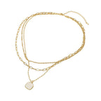 Sensibling Corp. 18K Gold Dipped Square Pendant Accent Mixed Paperclip Chain Layered Necklace featuring three distinct chain styles and a small square pendant on the shortest chain, with an adjustable extender for the perfect fit. Shown against a white background.
