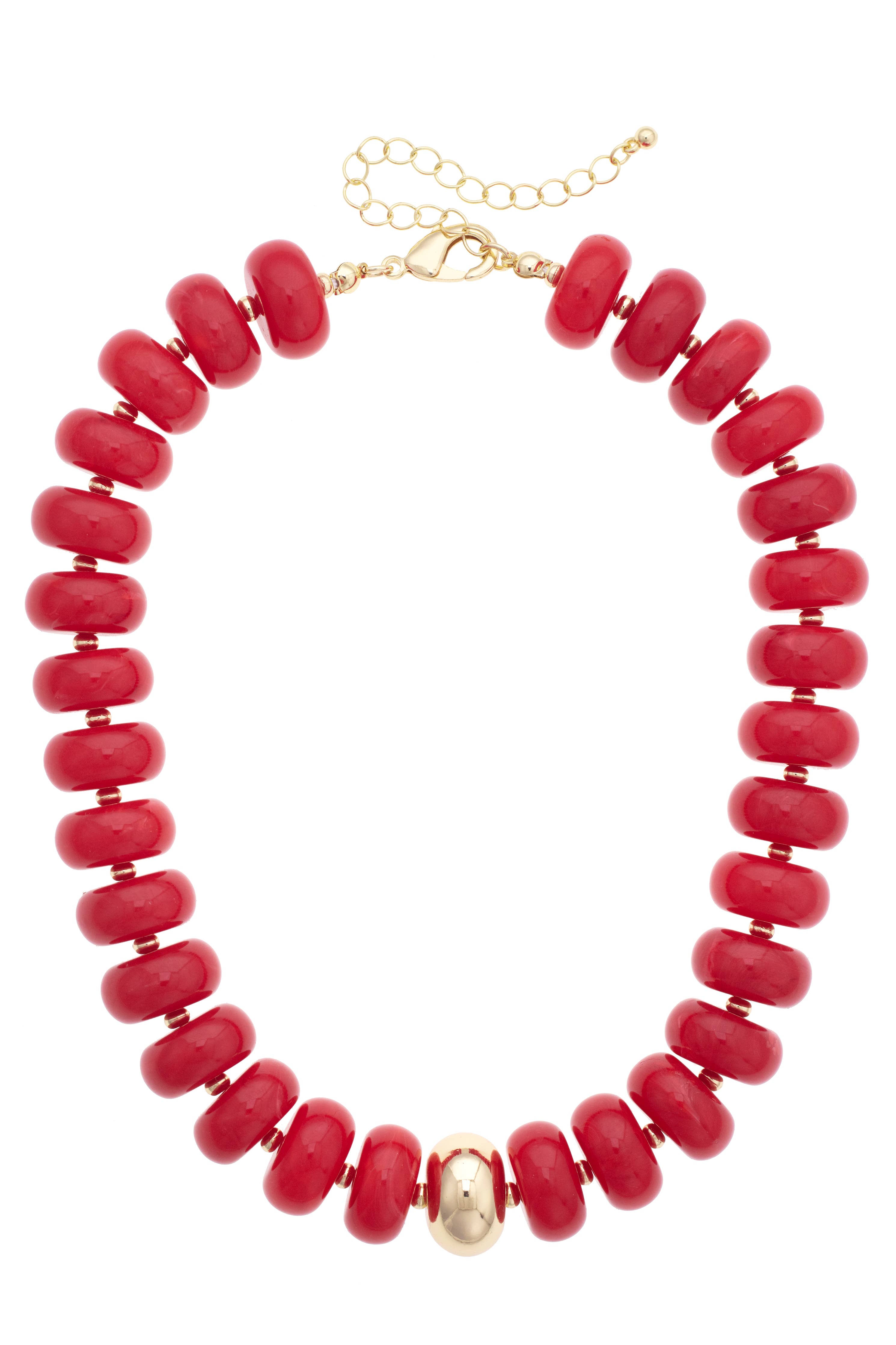 The San Sebastián Beaded Resin Necklace by Canvas Style features large round red resin beads, a single gold bead at the center, and an adjustable gold chain clasp. This bold statement piece effortlessly elevates any outfit.